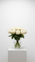 Classic white rose bouquet in glass vase