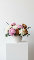 Seasonal mixed peony bouquet in ceramic vessel